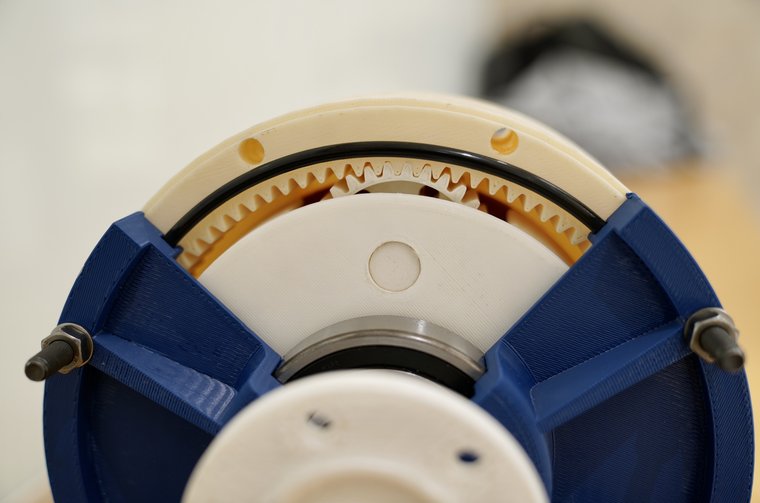 The gearbox opened, showing the ring gear teeth and the planets.