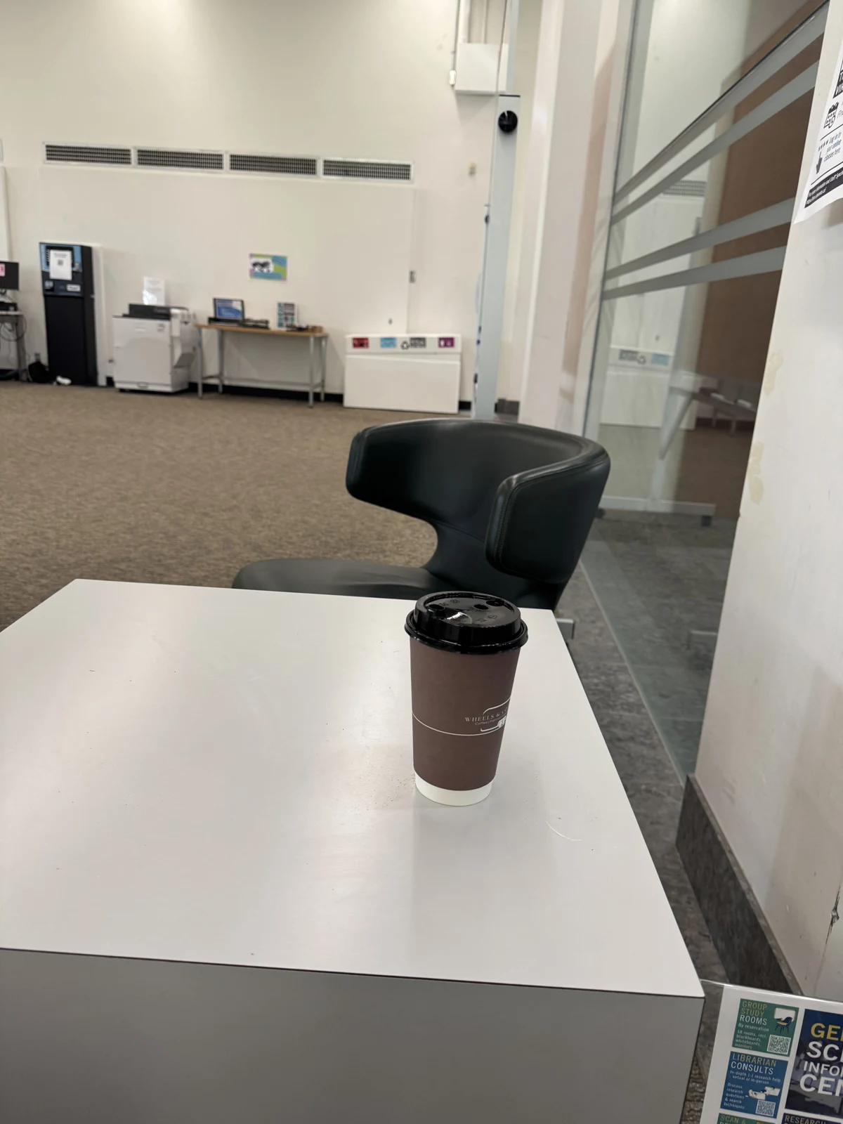 A takeaway coffee cup on a white table, the first Rehearse reconstruction example